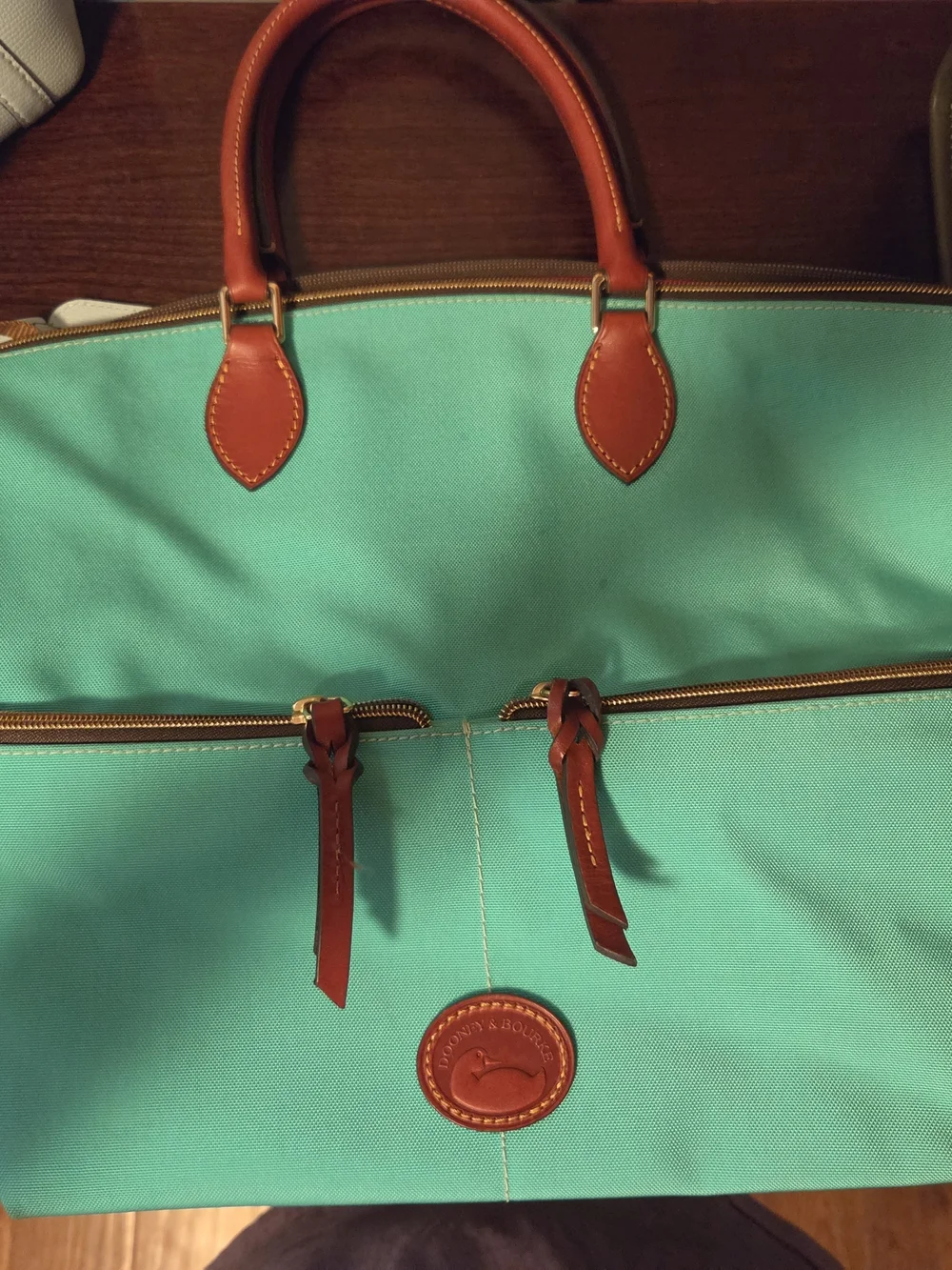 Michael Kors, Kate Spade And Dooney And Burke
